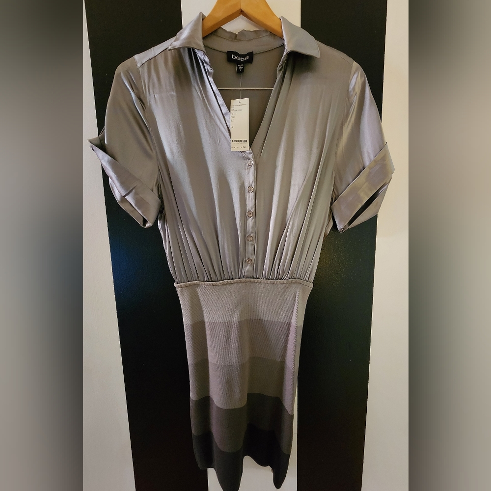 Bebe. Gray Dress. W/price tag. Never worn. Size Small.